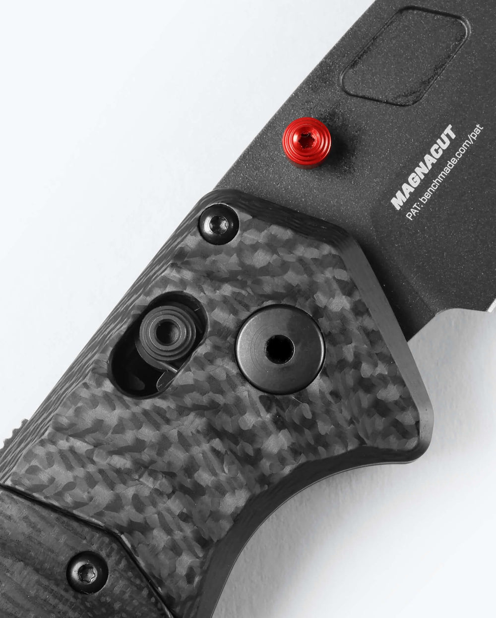 PSK® Carbon Fiber Handle Detail - AXIS Lock & Red Button Close-up | Benchmade Knife Co.