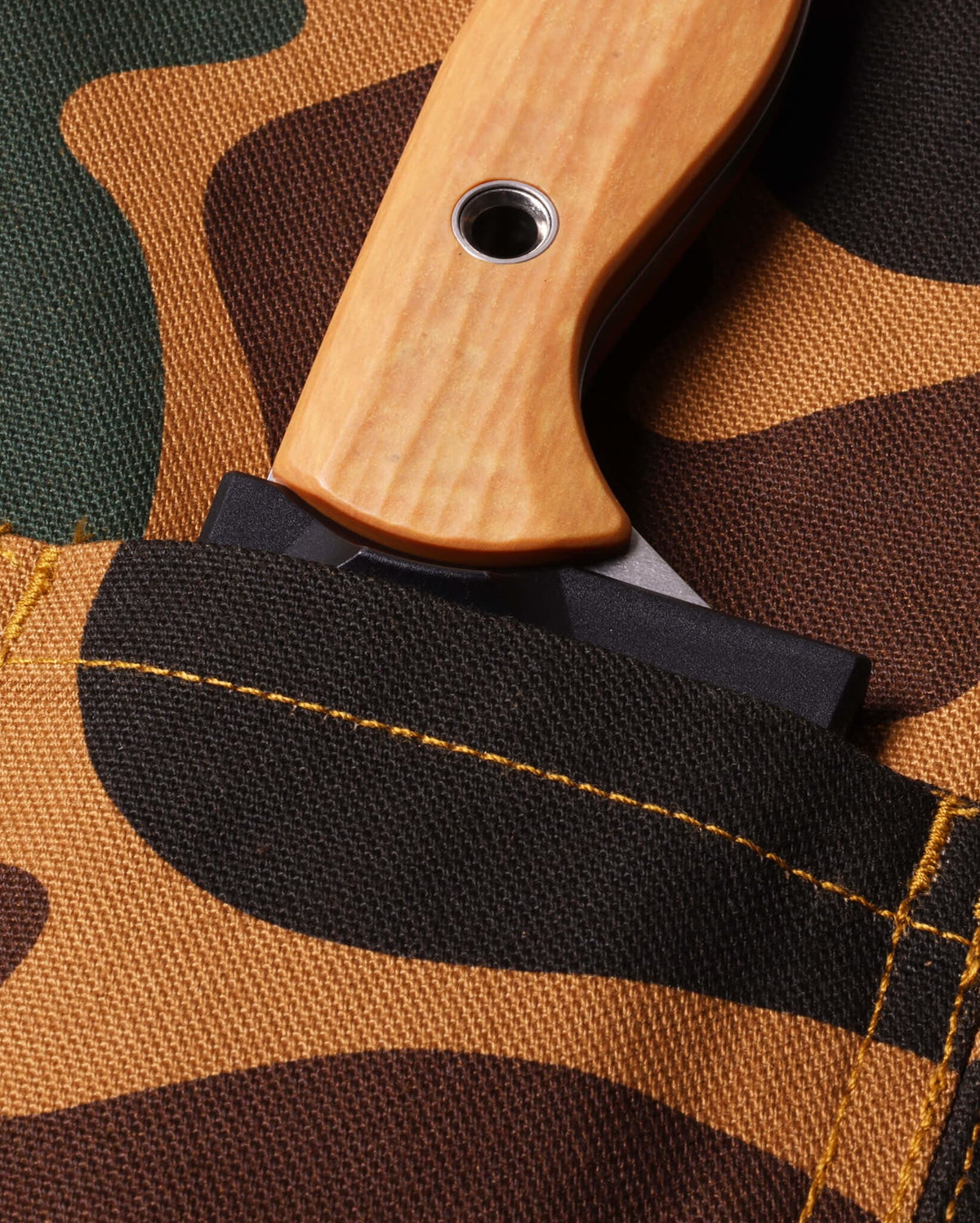 Duck Camo Canvas Knife Roll Apron - Close-Up of Blade Slot Pocket with Knife Handle | Benchmade Knife Co.