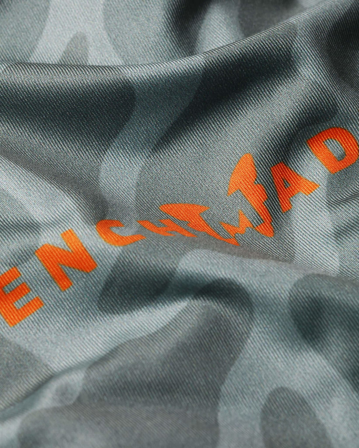 Camo Men's Sun Hoodie Fabric Detail - Orange Benchmade Logo on Stretch Knit | Benchmade Knife Co.