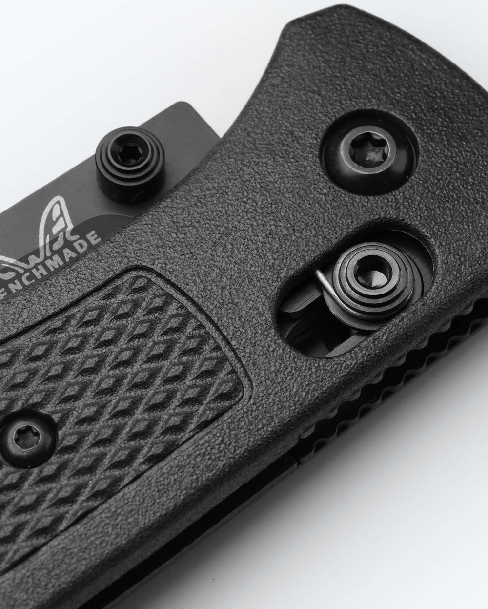 Bugout® CF-Elite® knife close-up detail of carbon fiber handle and hardware | Benchmade Knife Co.