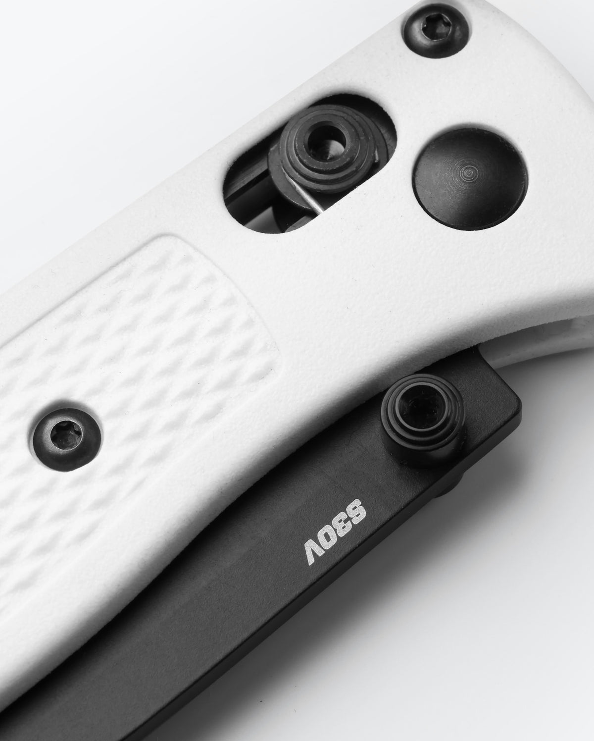 Mini Bugout® White Grivory® - AXIS Lock Mechanism Close-up Detail | Benchmade Knife Co.