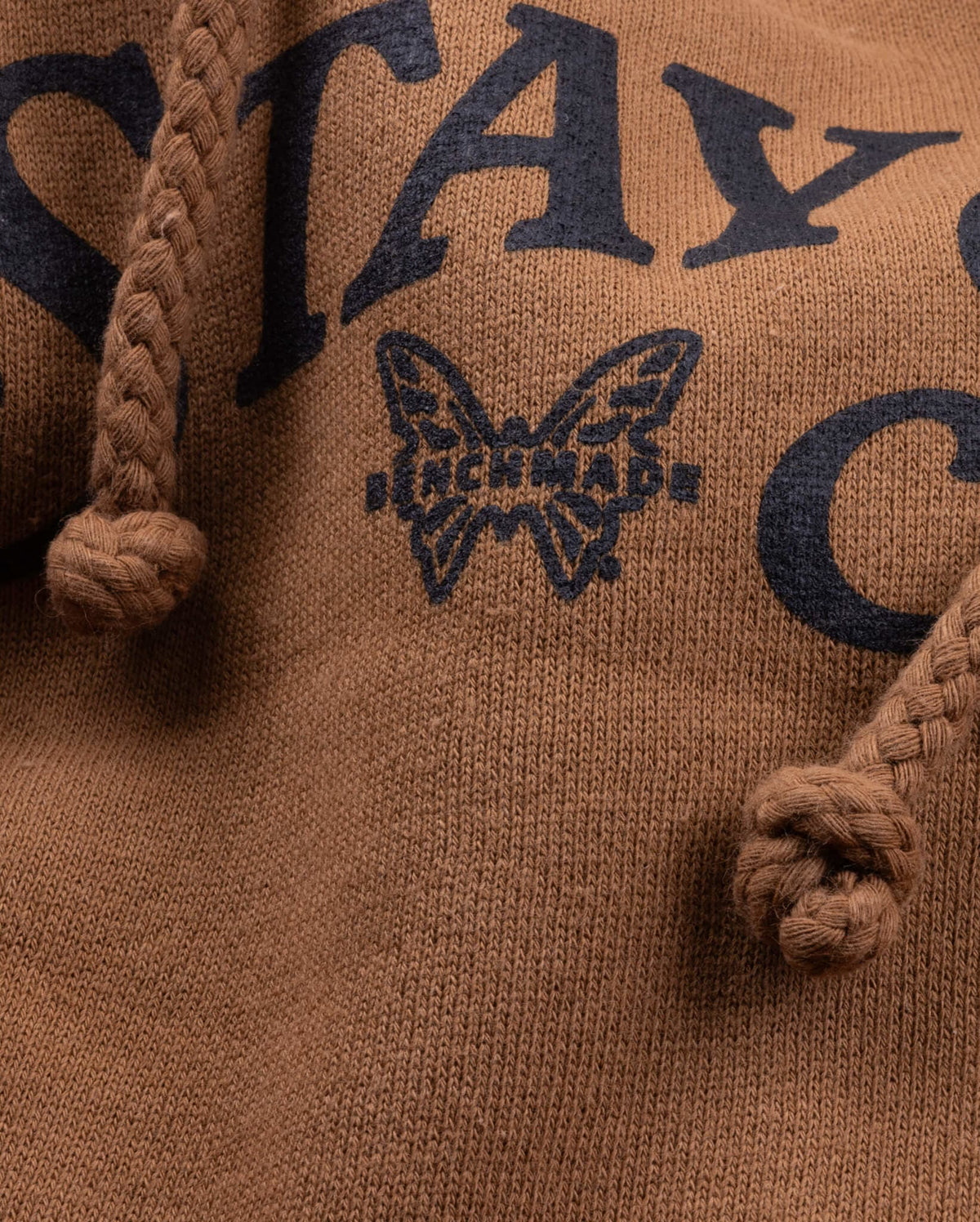 Stay Sharp Text and Butterfly Logo Detail - Close-up of Hoodie Graphics | Benchmade Knife Co.