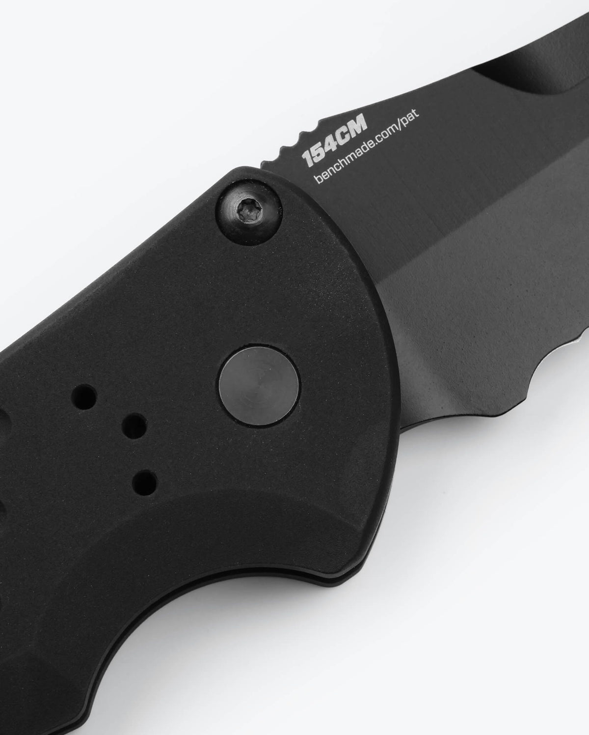 Auto Stryker® 154CM Steel Close-up - Button Detail | Benchmade Knife Co.