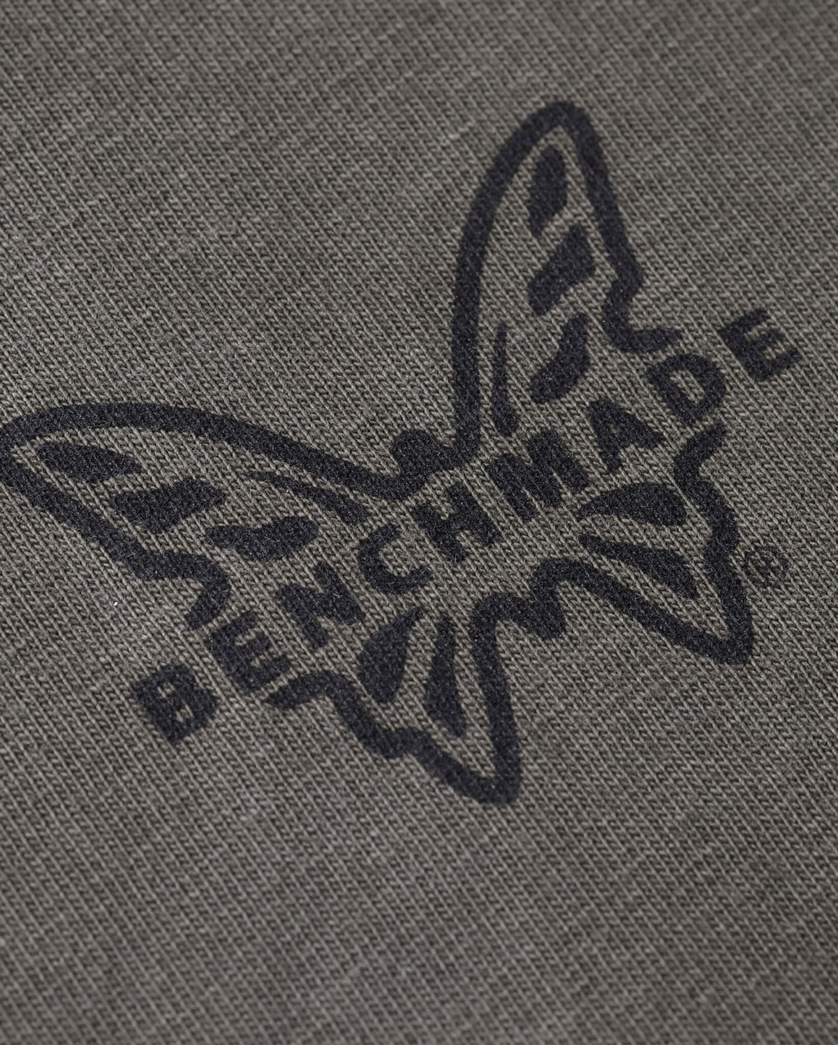 Trawler SS Tee Chest Logo Close-Up - Black Benchmade Butterfly on Asphalt Cotton | Benchmade Knife Co.