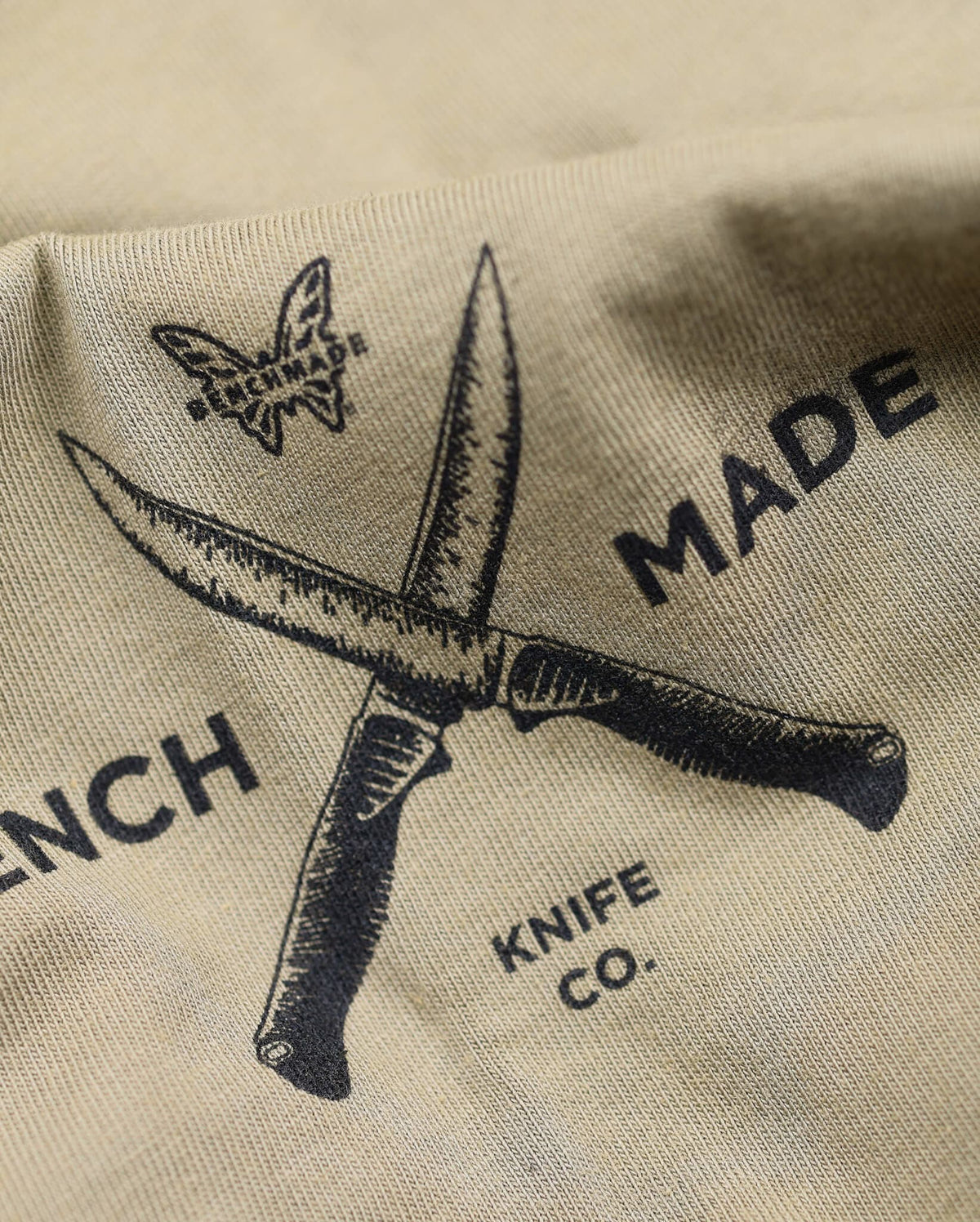Meatcrafter Tactical Knives Detail - Close-up of Crossed Blades Logo | Benchmade Knife Co.
