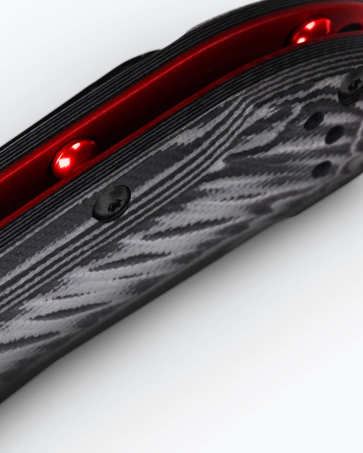 Mini Freek® Multicolor G10 - Close Up Red Liner Detail | Benchmade Knife Co.