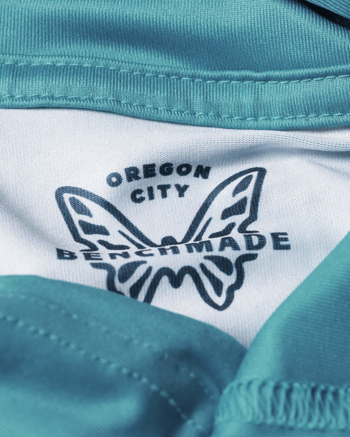 Depth Blue Sun Hoodie - Close-Up White Benchmade Butterfly Logo on Jersey-Knit Fabric | Benchmade Knife Co.