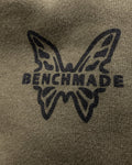 Close-up of Benchmade butterfly logo on olive hunting hoodie | Benchmade Knife Co.