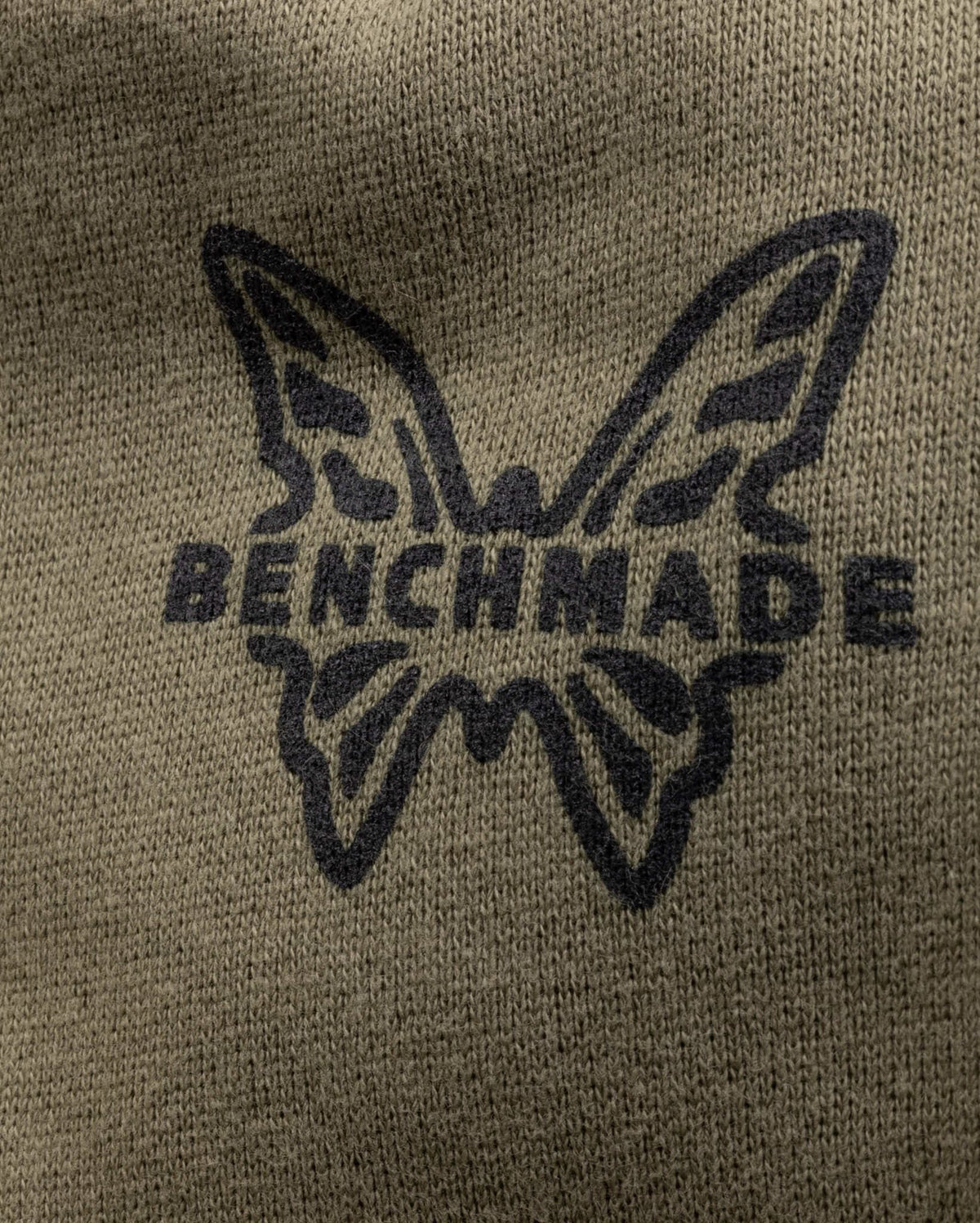 Close-up of Benchmade butterfly logo on olive hunting hoodie | Benchmade Knife Co.