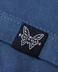Into The Wild Below Chest Graphic Close-Up on Depth Blue Cotton Tee - Print Detail | Benchmade Knife Co.
