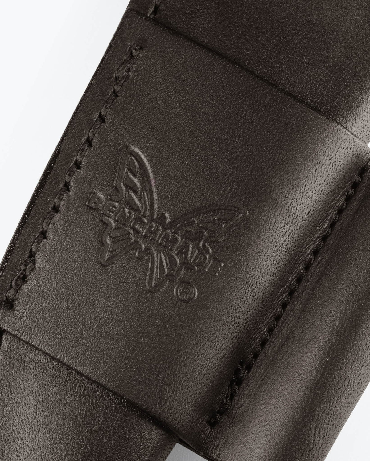 Embossed Butterfly Logo Close-up on Brown Leather Bushcrafter Sheath | Benchmade Knife Co.
